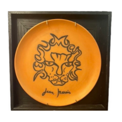 Orange plate with lyon design by Jean Marais